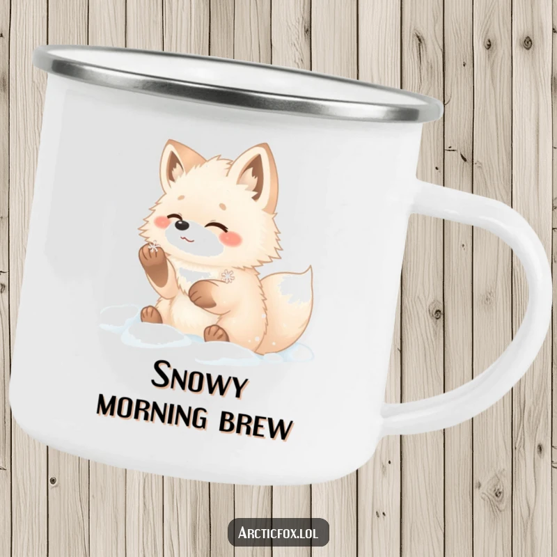 Funny arctic fox camping mug showing a fluffy fox with paws in snow, gleefully catching a snowflake.