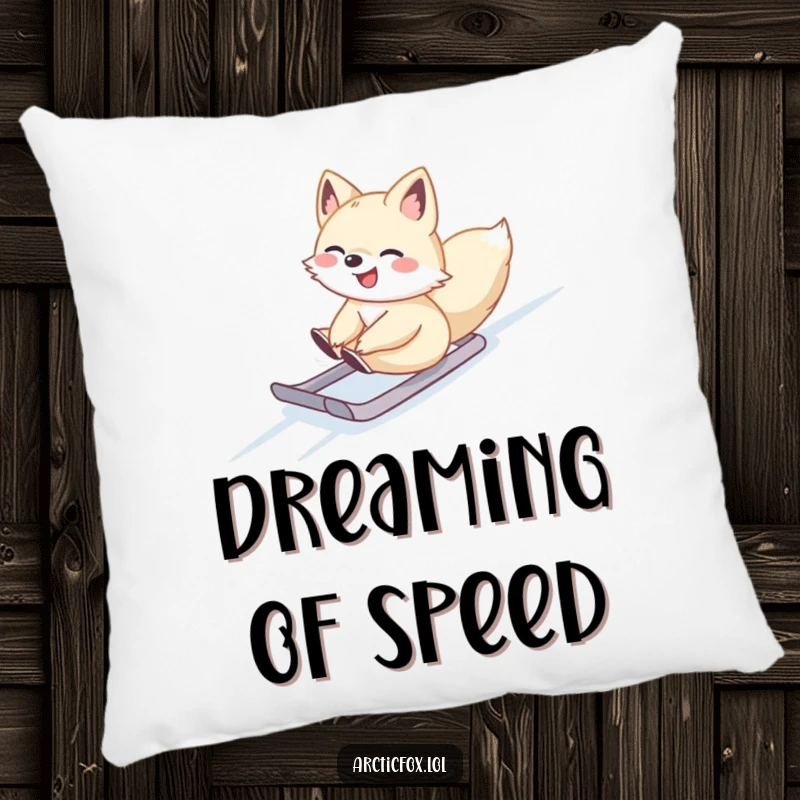 Cute Arctic fox gleefully sliding down a slope, featured on a soft pillow for winter coziness.
