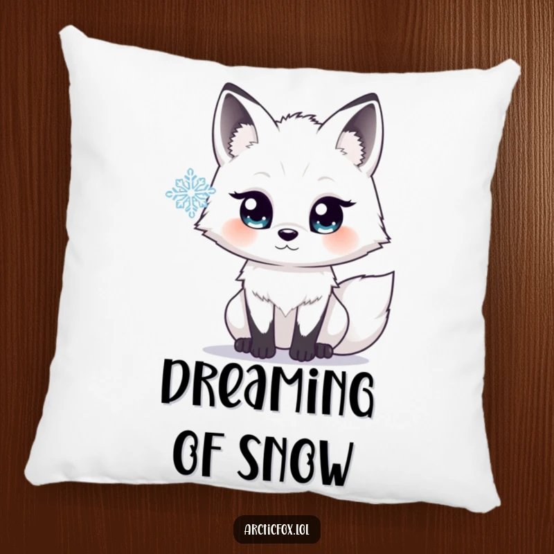 Funny pillow showing an arctic fox with wide, luminous eyes, gazing in quiet wonder at a nearby delicate snowflake.