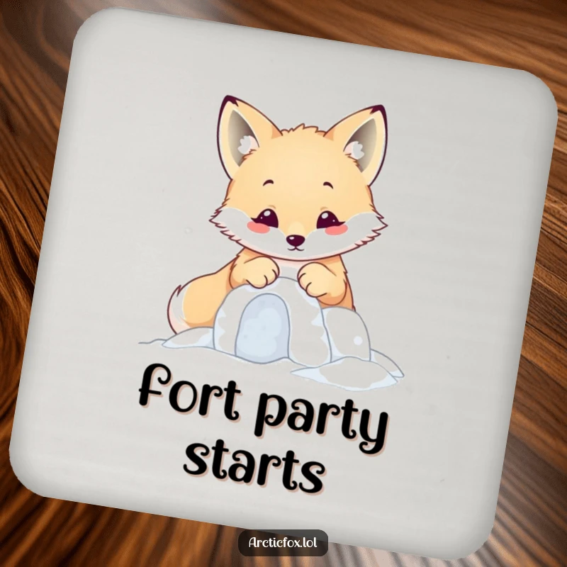 Funny kawaii arctic fox building a tiny snow fort with its paws, featured on a cute drink coaster.