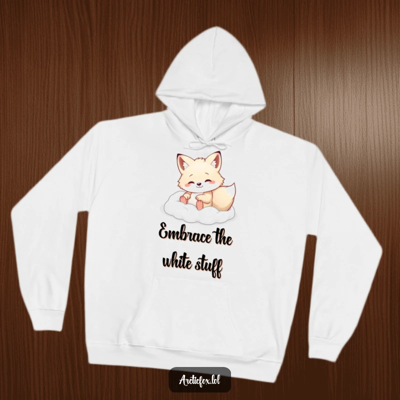 Arctic fox happily rolling in soft white powder, featured on a cozy hoodie, great for winter comfort.