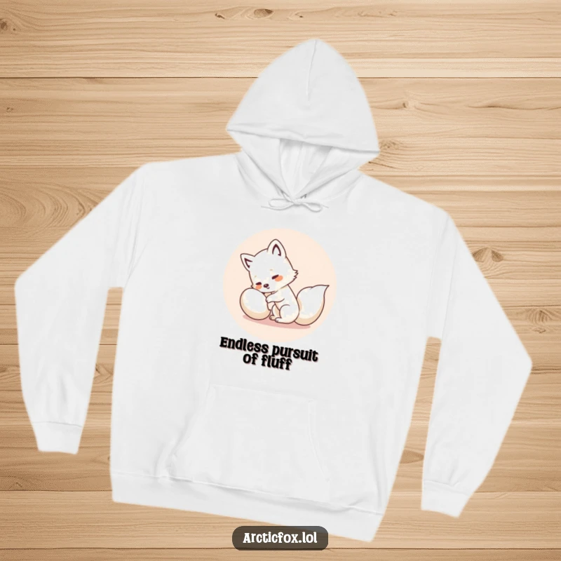 Funny Kawaii Arctic Fox Hoodie: Soft, warm hoodie showcasing a cute white fox comically chasing its tail, spreading giggles.