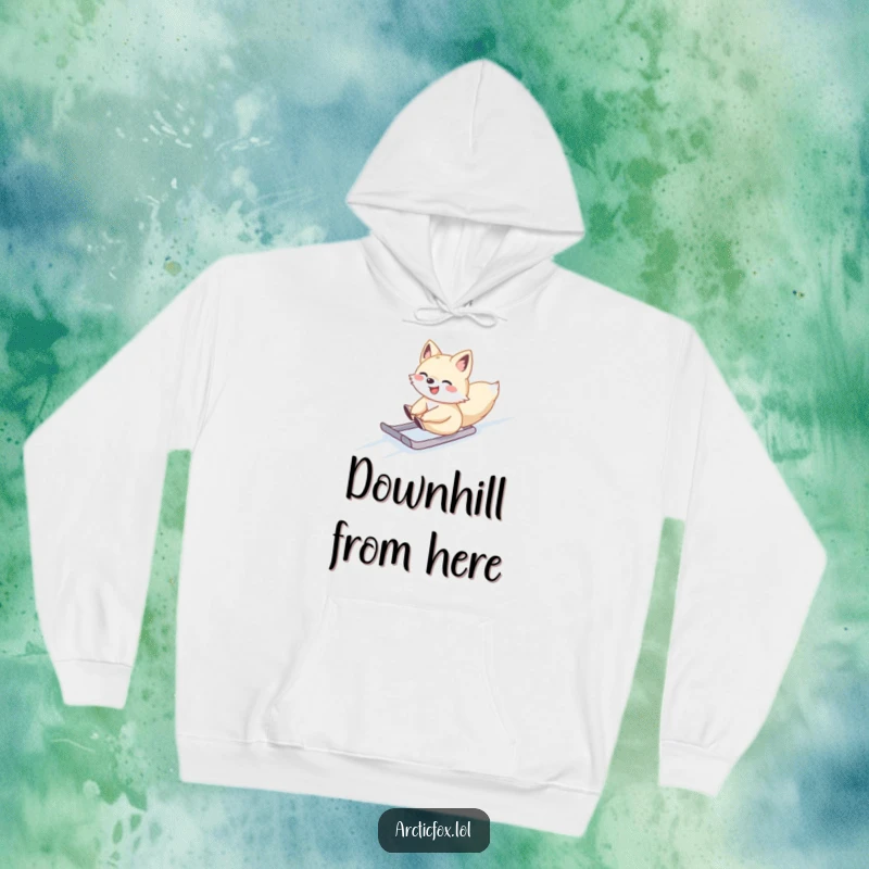 Cute Arctic fox gleefully sliding down a slope, featured on a cozy hoodie, great for winter warmth.