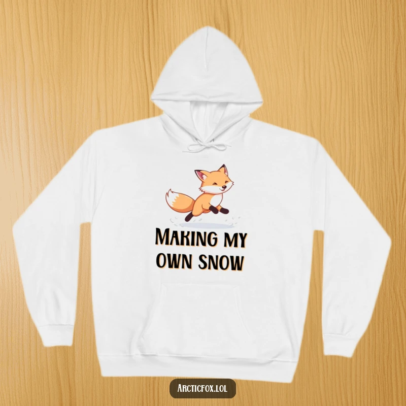 Funny Arctic Fox Hoodie: Cozy pullover featuring an energetic fox kicking snow, perfect for winter fun and as a funny gift.