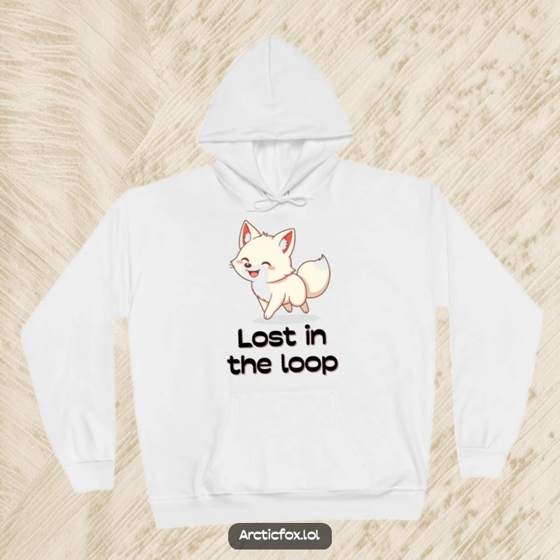 Funny hoodie showing a beaming arctic fox caught in a comical, never-ending loop of chasing its own fluffy tail.