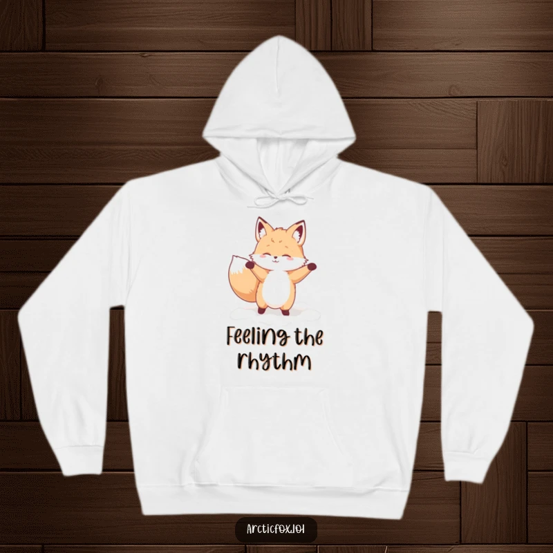 Funny hoodie with a fluffy fox character caught mid-silly-dance, surrounded by soft, fluffy snow, looking utterly joyful.