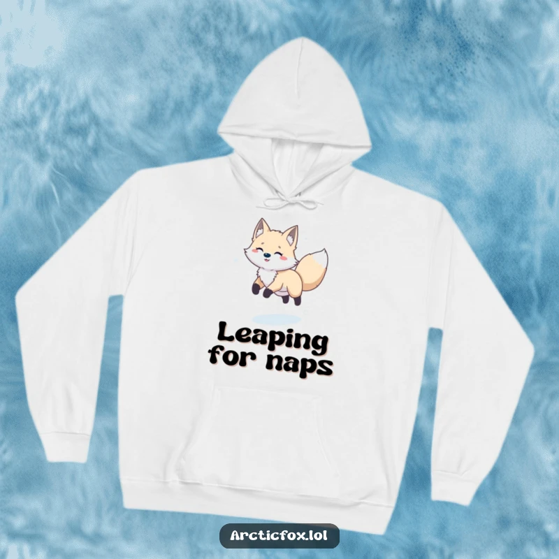 Funny happy arctic fox joyfully leaping through a snowy landscape, featured on a cozy hoodie.