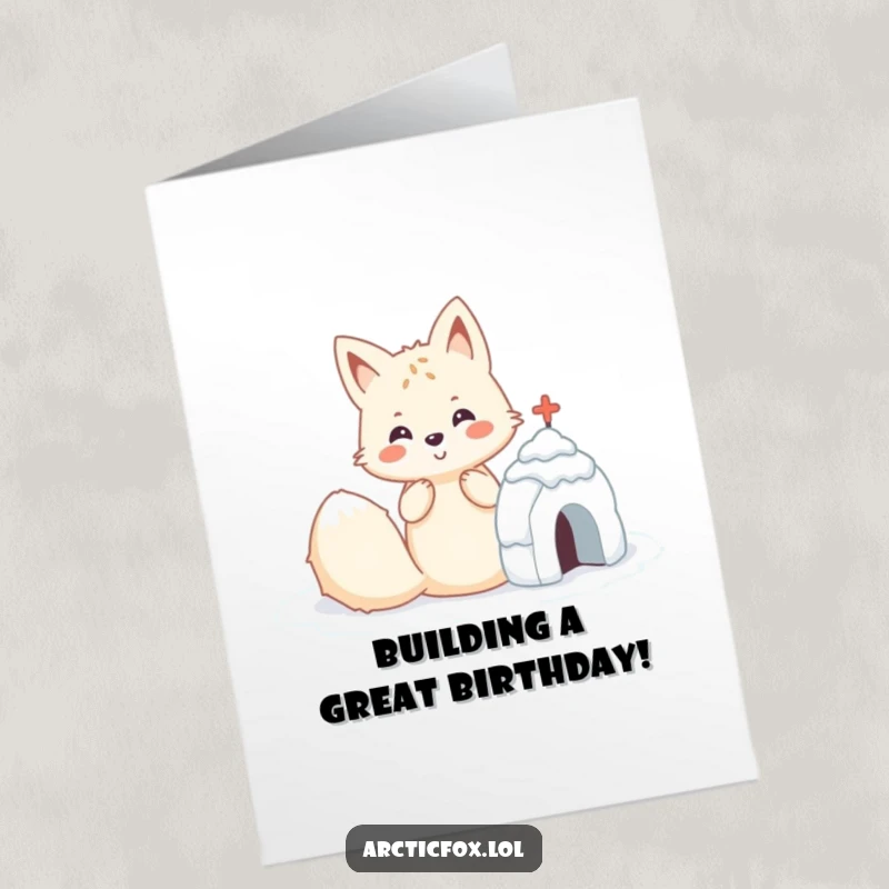 Funny Free Printable Birthday Card featuring a cheerful Kawaii arctic fox diligently constructing a small, perfectly formed snow fort.