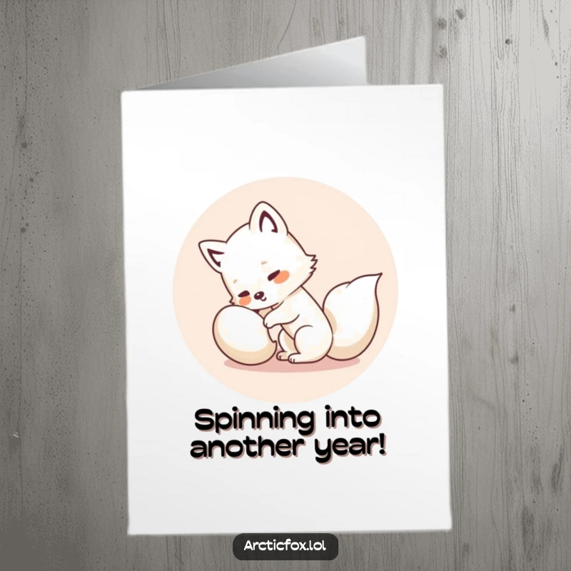 Funny free printable birthday card with a cute kawaii arctic fox spinning in a circle trying to catch its tail.
