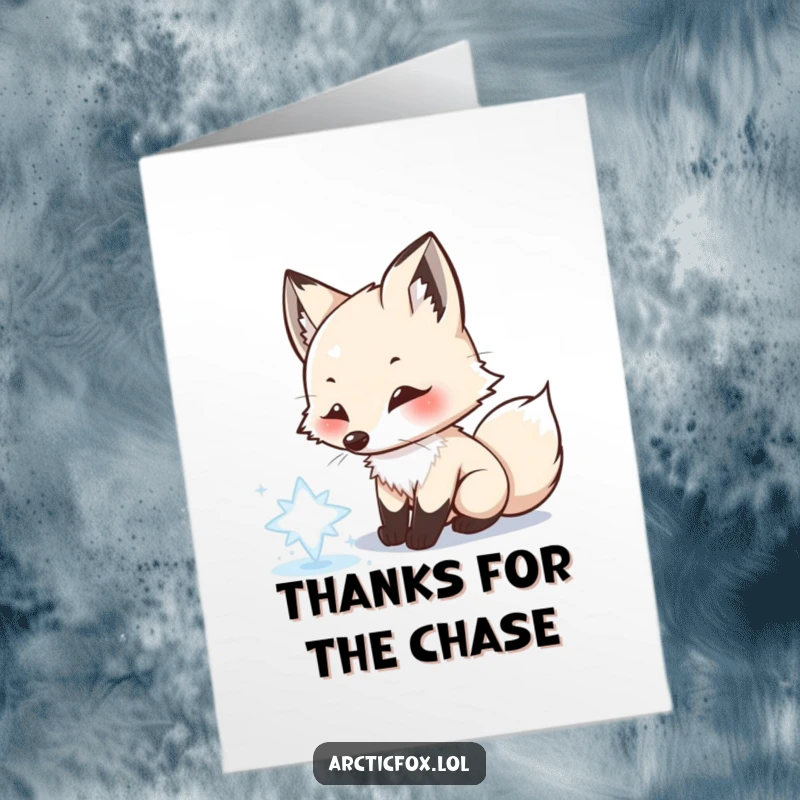Funny Free Printable Thank You Card: Playful Arctic Fox chasing a shimmering snowflake with its nose, sending thanks.