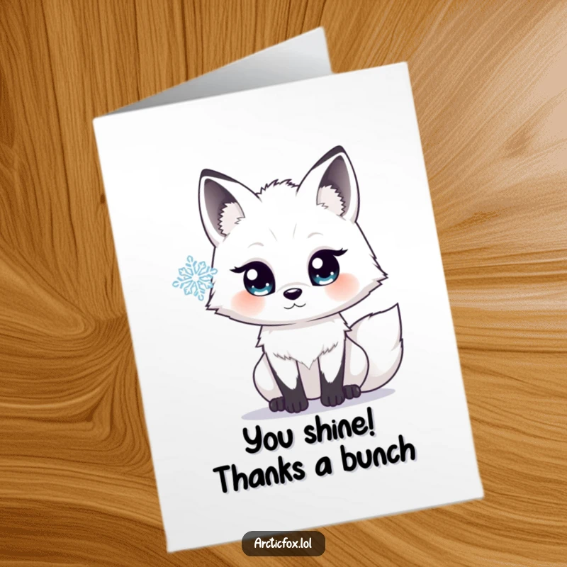 Free Printable Thank You Card: Arctic fox with wide, sparkling eyes focused on a single, perfect snowflake.