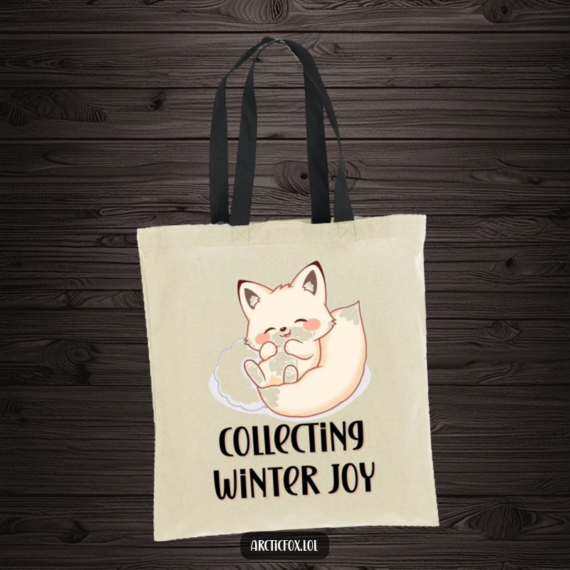 Funny tote bag showing an arctic fox joyfully rolling onto its back in a soft, fluffy drift of snow.